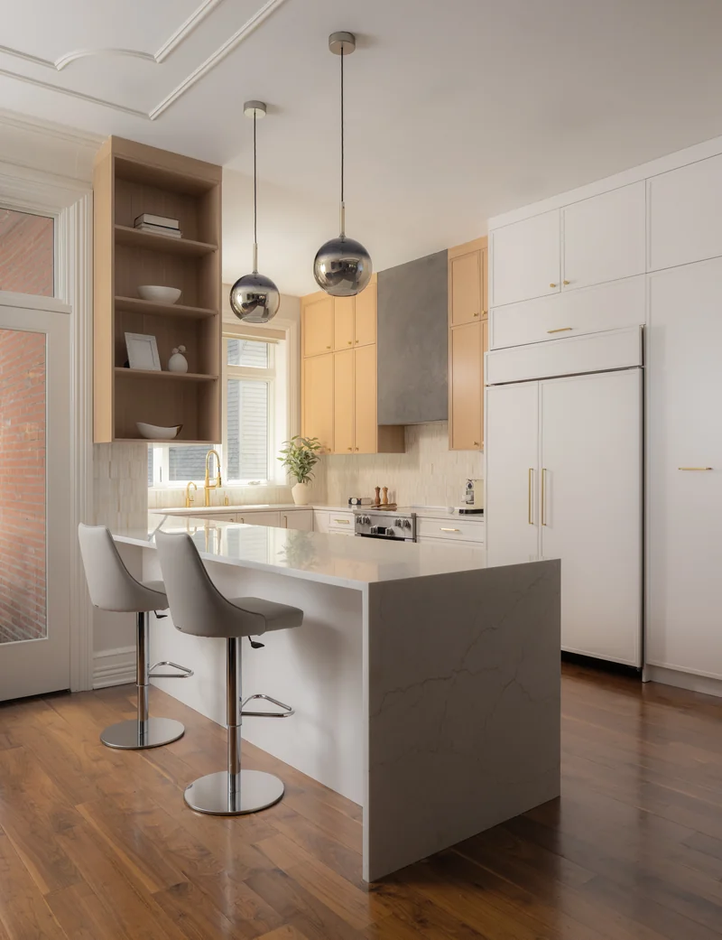 Bloomfield St Hoboken kitchen with oak cabinetry, waterfall island and glass pendant lights